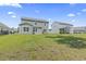 Spacious backyard featuring lush lawn and view of the home's exterior, perfect for outdoor activities at 597 Heritage Downs Dr., Conway, SC 29526