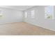 Bright, spacious bedroom with neutral carpet and plenty of natural light from multiple windows at 597 Heritage Downs Dr., Conway, SC 29526