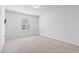Simple bedroom with large window, soft carpet, and a minimalist aesthetic at 597 Heritage Downs Dr., Conway, SC 29526