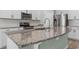 Close-up of kitchen island with granite countertops, stainless steel appliances, and ample cabinet space at 597 Heritage Downs Dr., Conway, SC 29526
