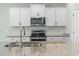 Detailed view of kitchen with stainless steel appliances, granite countertops, and white subway tile backsplash at 597 Heritage Downs Dr., Conway, SC 29526