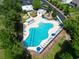 Aerial view of a large community pool with ample seating, playground, and recreation area at 597 Heritage Downs Dr., Conway, SC 29526
