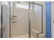 Modern walk-in shower with glass enclosure and tiled walls, featuring a built-in bench at 597 Heritage Downs Dr., Conway, SC 29526