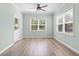 Inviting sun room with natural light, hardwood floors, and serene backyard views at 597 Heritage Downs Dr., Conway, SC 29526