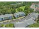 Aerial view of the community with buildings, parking, landscaping, and a golf course in the background at 6015 Catalina Dr. # 932, North Myrtle Beach, SC 29582