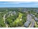 Beautiful aerial view of a condo community along a verdant green golf course with views of the beach skyline at 6015 Catalina Dr. # 932, North Myrtle Beach, SC 29582