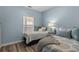 Bright bedroom featuring two beds, wood flooring, and a window with views at 6015 Catalina Dr. # 932, North Myrtle Beach, SC 29582