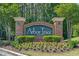 Landscaped entrance sign for Arbor Trace community with seasonal flowers at 6015 Catalina Dr. # 932, North Myrtle Beach, SC 29582