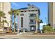 Exterior view of Barefoot Resort's Beach Cabana building, showcasing its coastal architectural style and entrance at 6015 Catalina Dr. # 932, North Myrtle Beach, SC 29582
