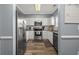 Modern kitchen with white cabinets, stainless steel appliances, and granite countertops at 6015 Catalina Dr. # 932, North Myrtle Beach, SC 29582
