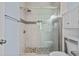 Tiled shower featuring a glass door, rainfall shower head and tiled accent wall at 6015 Catalina Dr. # 932, North Myrtle Beach, SC 29582