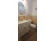 Well-lit bathroom featuring a white vanity with storage and a tiled floor at 610 Hibiscus Ave. # 610, Myrtle Beach, SC 29572