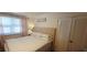 Bedroom featuring large bed, neutral colors, and white louvered closet door at 610 Hibiscus Ave. # 610, Myrtle Beach, SC 29572