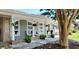 Charming front porch with lattice trim, lovely planters, and decorative white rock landscaping at 610 Hibiscus Ave. # 610, Myrtle Beach, SC 29572