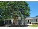 Charming one-story home with a welcoming front porch and a beautiful mature tree in the front yard at 610 Hibiscus Ave. # 610, Myrtle Beach, SC 29572