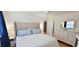 Serene bedroom featuring a luxurious bed, hardwood floors, and ample natural light at 610 Hibiscus Ave. # 610, Myrtle Beach, SC 29577