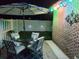 Outdoor patio area illuminated at night with string lights and decorative wall lighting at 610 Hibiscus Ave. # 610, Myrtle Beach, SC 29577