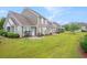 Expansive backyard with well-maintained lawn and patios for outdoor entertaining at 6172 Catalina Dr. # 414H, North Myrtle Beach, SC 29582