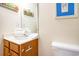 Cozy bathroom featuring a wood vanity and an oversized mirror at 6172 Catalina Dr. # 414H, North Myrtle Beach, SC 29582