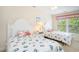 Inviting bedroom showcases two twin beds with light seaside-themed bedding and bright window view at 6172 Catalina Dr. # 414H, North Myrtle Beach, SC 29582