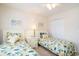 Guest bedroom featuring two twin beds, white dressers, and closet at 6172 Catalina Dr. # 414H, North Myrtle Beach, SC 29582