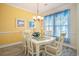 Sunny dining room with large windows and modern decor at 6172 Catalina Dr. # 414H, North Myrtle Beach, SC 29582