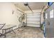 Organized garage with bikes, storage, and a functional door, offering ample space at 6172 Catalina Dr. # 414H, North Myrtle Beach, SC 29582