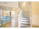 Hallway view featuring stairs, open floorplan, and bar-style seating at 6172 Catalina Dr. # 414H, North Myrtle Beach, SC 29582