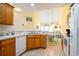 Open kitchen flowing into the living and dining areas, featuring bright lighting at 6172 Catalina Dr. # 414H, North Myrtle Beach, SC 29582