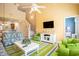 Spacious living room featuring high ceilings, a ceiling fan, and a cozy seating area at 6172 Catalina Dr. # 414H, North Myrtle Beach, SC 29582