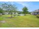 Picturesque pond view surrounded by lush green grass and trees in a well-maintained community at 6172 Catalina Dr. # 414H, North Myrtle Beach, SC 29582