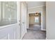 A carpeted foyer leads into this well-maintained home with neutral colors and decorative glass front door at 628 Lake Estates Ct., Conway, SC 29526