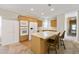 View of the kitchen features an island with seating, modern appliances, and a seamless connection to living area at 628 Lake Estates Ct., Conway, SC 29526