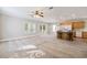 The expansive living area flows into the kitchen, with lots of natural light and access to a covered back porch at 628 Lake Estates Ct., Conway, SC 29526