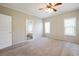 Main bedroom features three windows allowing lots of sunlight and an ensuite bathroom at 628 Lake Estates Ct., Conway, SC 29526