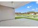Covered patio offers a serene view of the landscaped yard and the community pond at 651 Snowy Owl Way, Conway, SC 29527
