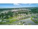Extensive aerial view of a residential community featuring a mix of homes, green spaces, and scenic ponds at 668 Rycola Circle, Surfside Beach, SC 29575