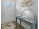 Inviting entryway featuring a stylish console table, coastal decor, and a decorative shell art piece at 668 Rycola Circle, Surfside Beach, SC 29575