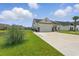 Beautiful single-Gathering home with a long driveway, well-maintained lawn, and a tranquil pond nearby at 668 Rycola Circle, Surfside Beach, SC 29575