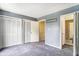 Bedroom includes multiple closets, neutral walls, plush carpet, and access to other rooms in the house at 6703 Jefferson Pl. # G5, Myrtle Beach, SC 29572