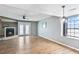 Spacious living room with hardwood floors, a fireplace, and access to an outdoor area at 6703 Jefferson Pl. # G5, Myrtle Beach, SC 29572
