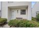 Inviting covered porch with a bench and well-maintained landscaping, offering a cozy outdoor space at 6703 Jefferson Pl. # G5, Myrtle Beach, SC 29572