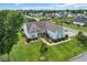An aerial view of a charming home surrounded by a lush, green lawn and mature trees at 700 Shell Point Ct., Longs, SC 29568