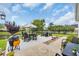 Outdoor patio area with a table, chairs, grill, and umbrella, perfect for entertaining or relaxation at 700 Shell Point Ct., Longs, SC 29568