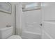 Bright bathroom featuring a shower-tub combination and tiled walls at 700 Shell Point Ct., Longs, SC 29568