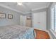 Bedroom with blue bedding, hardwood floors, ceiling fan, closet and dresser at 700 Shell Point Ct., Longs, SC 29568