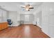 Expansive bedroom with hardwood floors, neutral paint, a ceiling fan, and plenty of natural light at 700 Shell Point Ct., Longs, SC 29568
