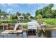 Picturesque community entrance featuring a dock, gazebo, and lush landscaping at 700 Shell Point Ct., Longs, SC 29568