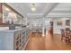 Spacious foyer with hardwood floors leading to a bright living area and dining space at 700 Shell Point Ct., Longs, SC 29568