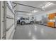 Spacious three-car garage with epoxy flooring, built-in storage, and a gray Jeep at 700 Shell Point Ct., Longs, SC 29568